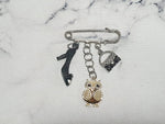 Rhinestone safety pin with dangling charm