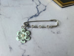 Rhinestone safety pin with dangling charm