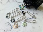 Rhinestone safety pin with dangling charm