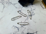 Rhinestone safety pin with dangling charm